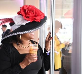 Enjoying a Black-Eyed Susan during the Preakness Stakes