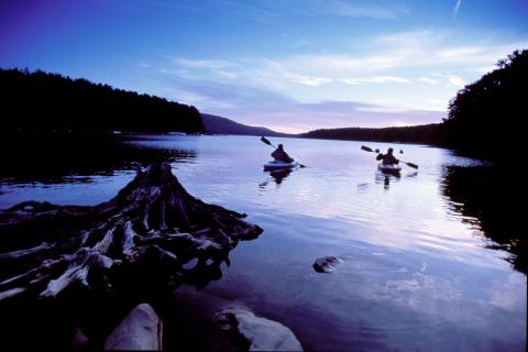 Two Kayakers on a lake at dusk