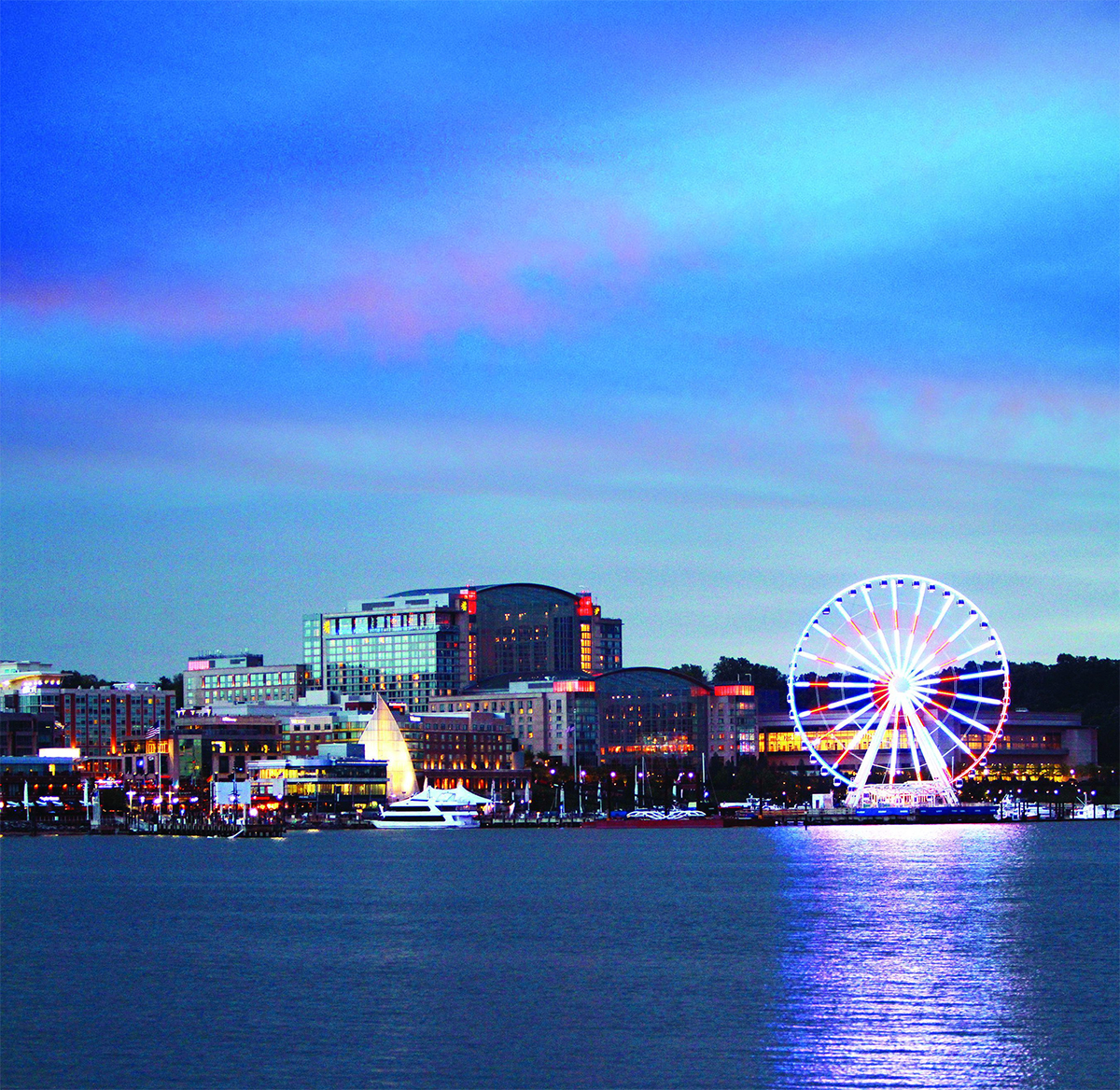 evening view of Gaylord National Resort and Capital Wheel from the water