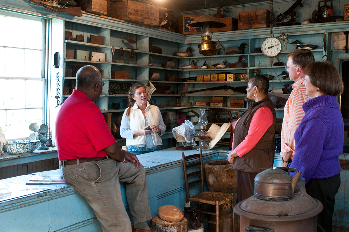 Customers talking to an employee inside the Bucktown Store in Cambridge
