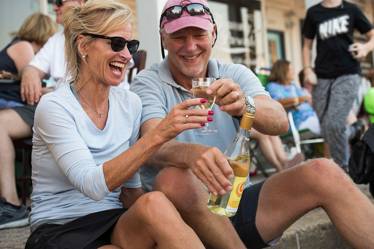 A couple enjoying a glass of wine together.