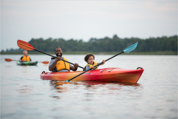 Father and son on a kayaking tour