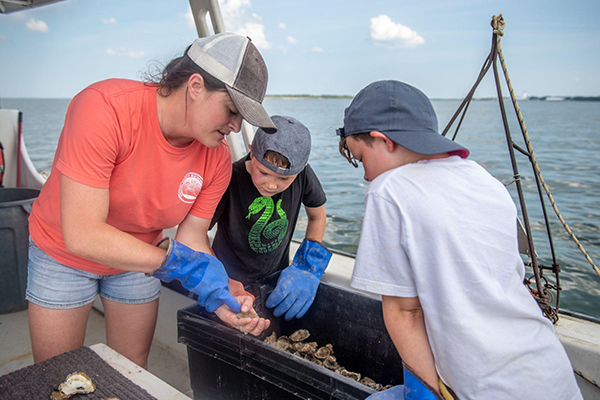 Solomons Island Heritage Tours Shucking Oysters