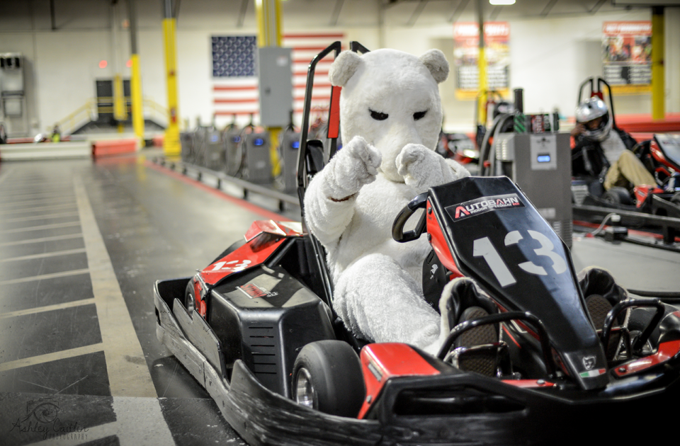 Bunny mascot riding in a go kart