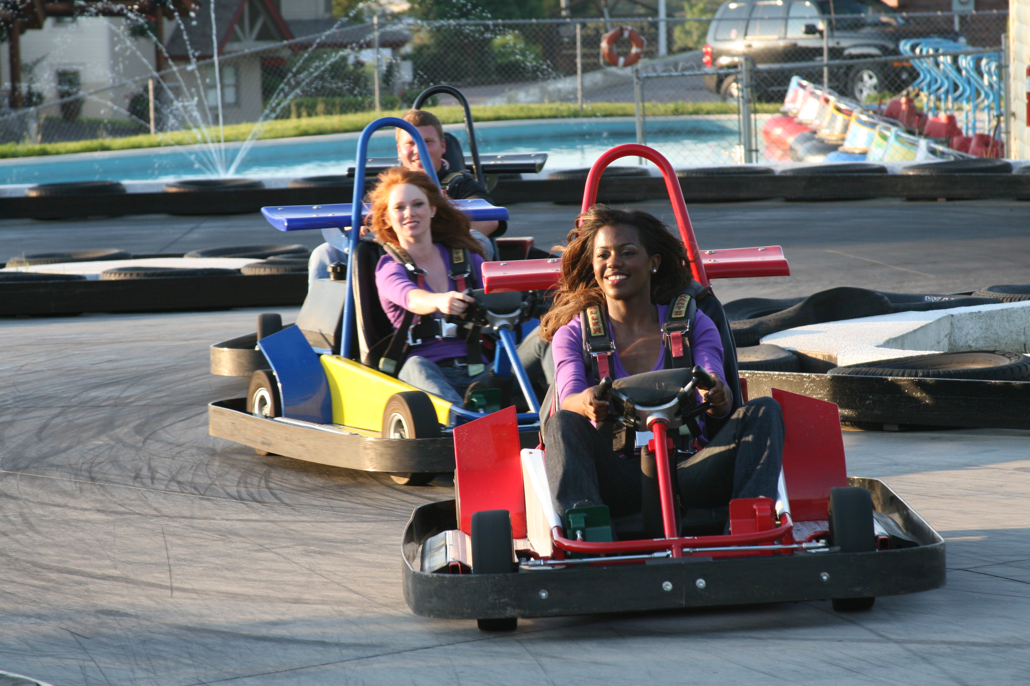People driving GoKarts