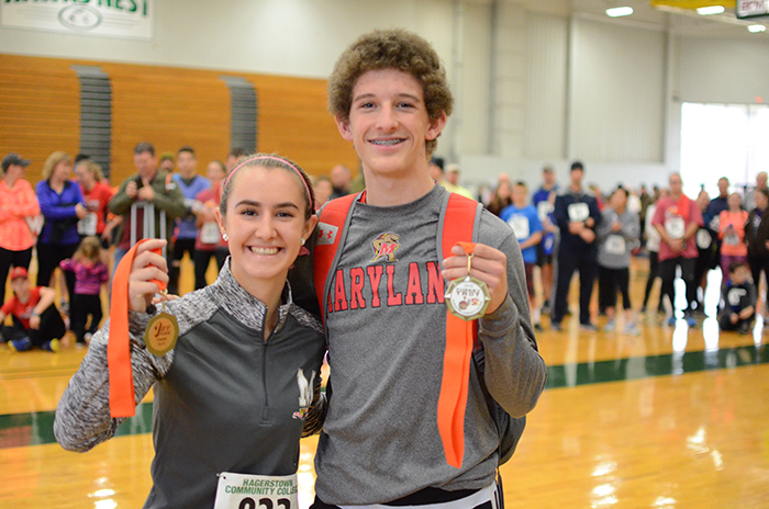 Young people holding medals