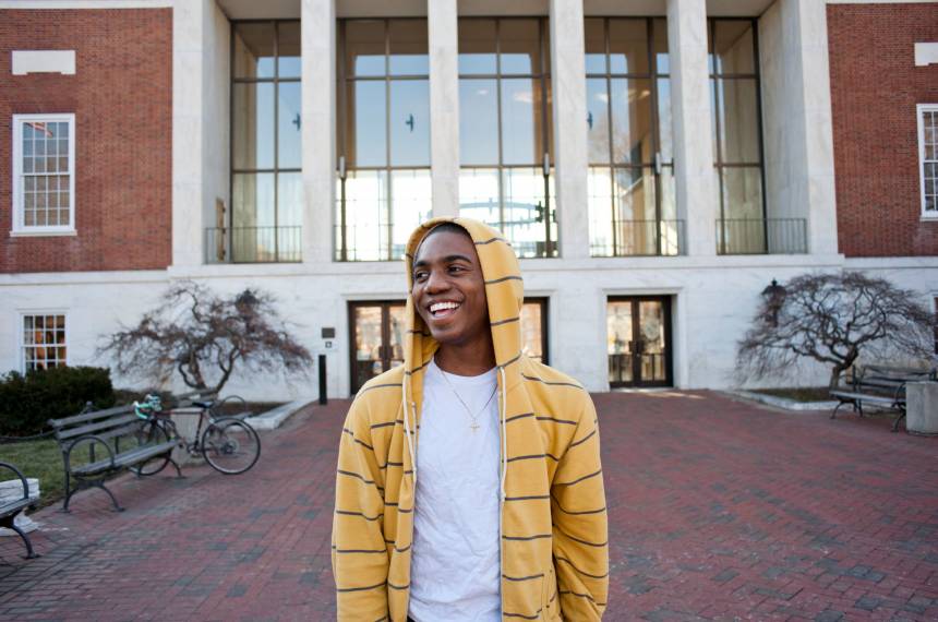Student in front of Johns Hopkins