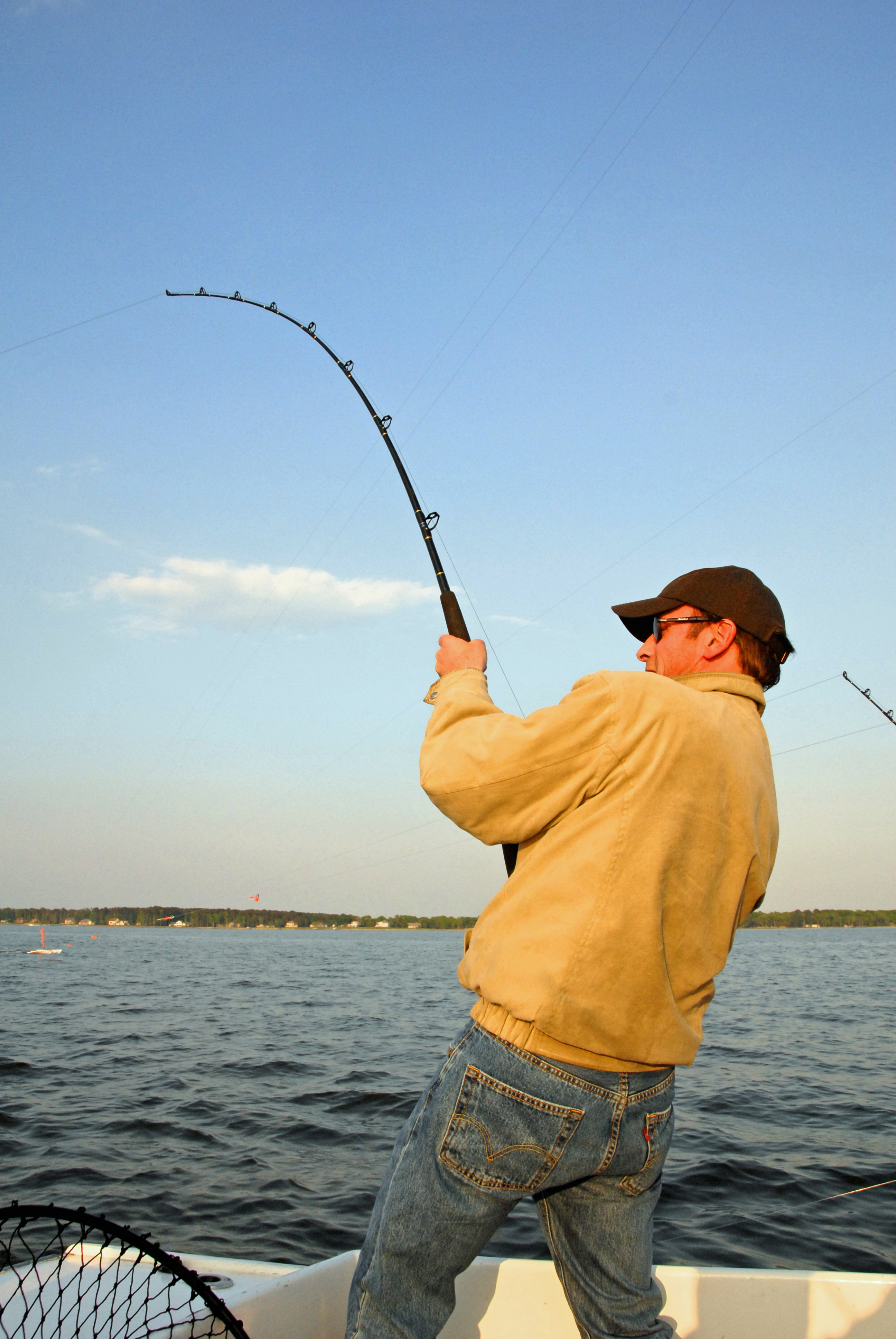 man fishing on boat