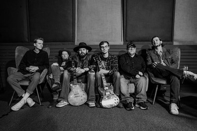 End of The Line Band sitting on couch Photo