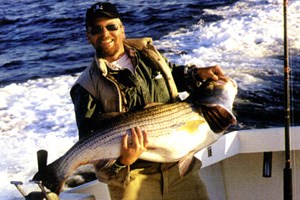 Fisherman holding a rockfish Photo