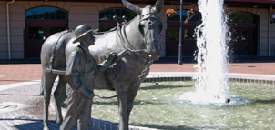 Statue of boy and donkey Photo