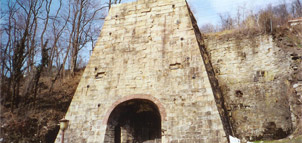 Entrance to stone blast furnace Photo
