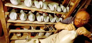 Man carving decoy ducks Photo