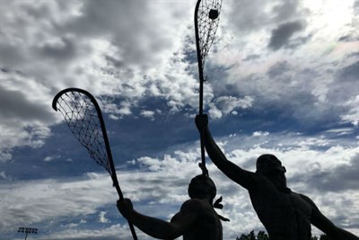 Statue of Native Americans playing LAX Photo