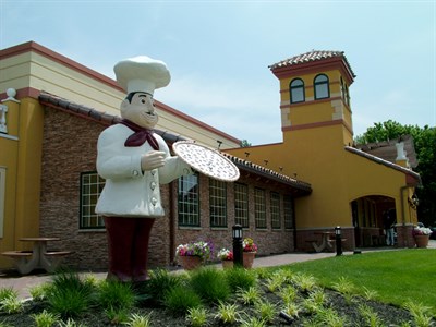 The iconic pizza man has been standing tall since 1977. Photo