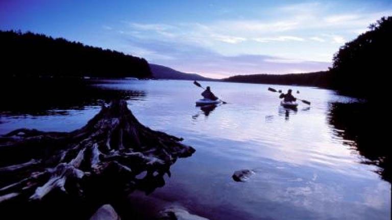 Two Kayakers on a lake at dusk