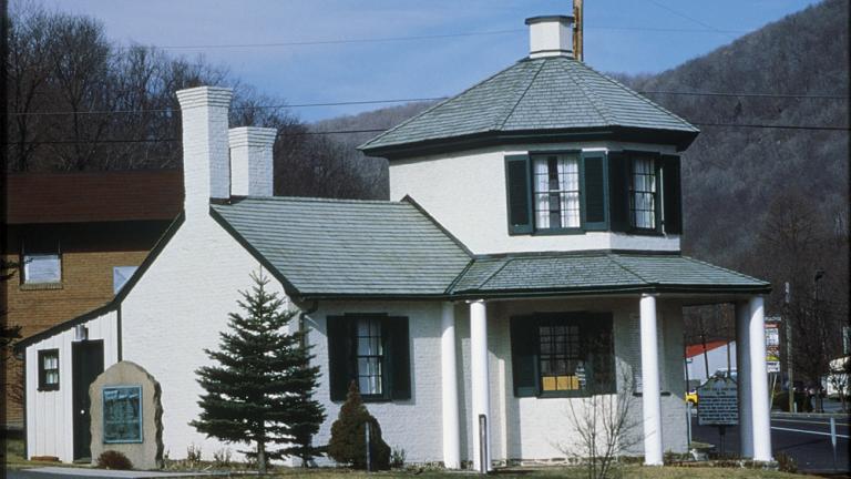 white house with green roof