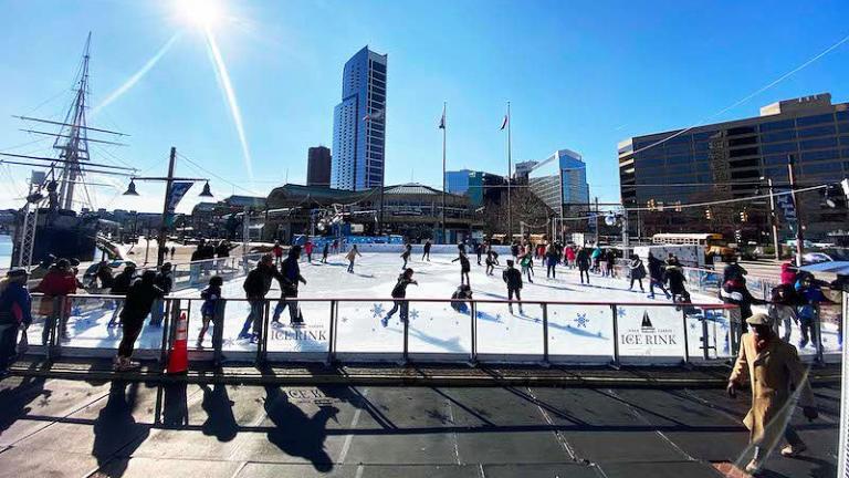 People ice skating at the Inner Harbor Ice Rink in Baltimore