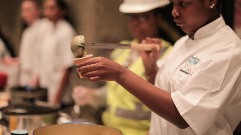 Chef serving soup