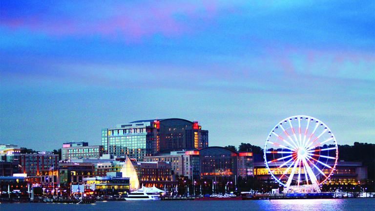 evening view of Gaylord National Resort and Capital Wheel from the water