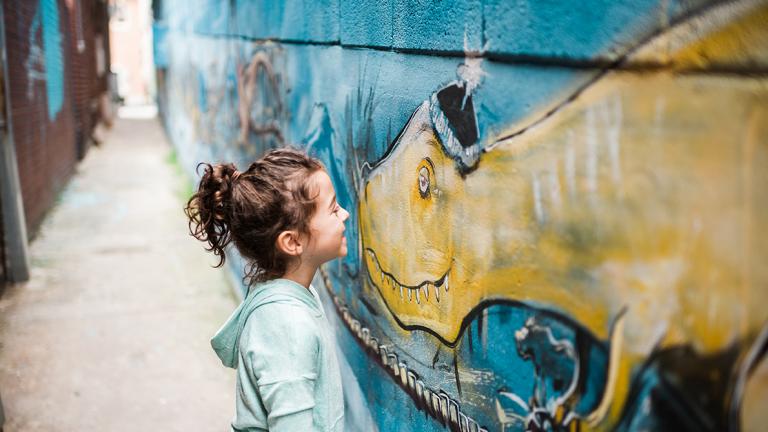 A Young Girl Makes A New Friend on the Public Art Trail 