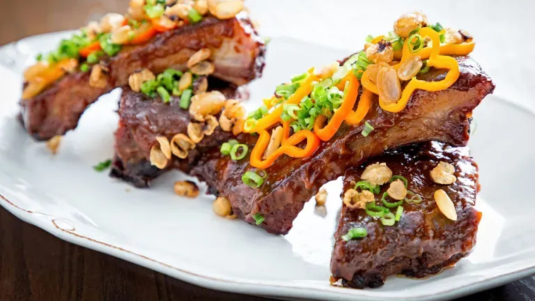 A plate of ribs from the Succotash Restaurant