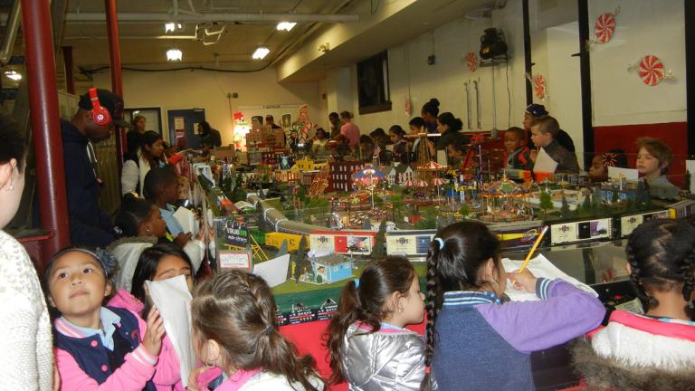 Children and adults enjoying the train garden.