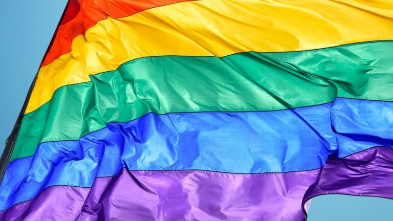 Rainbow flag and blue sky