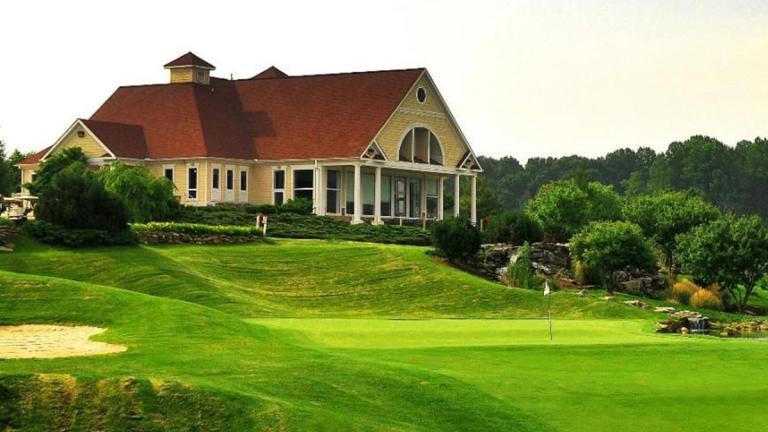 The Club House and a green at the P.B Dye Golf Course