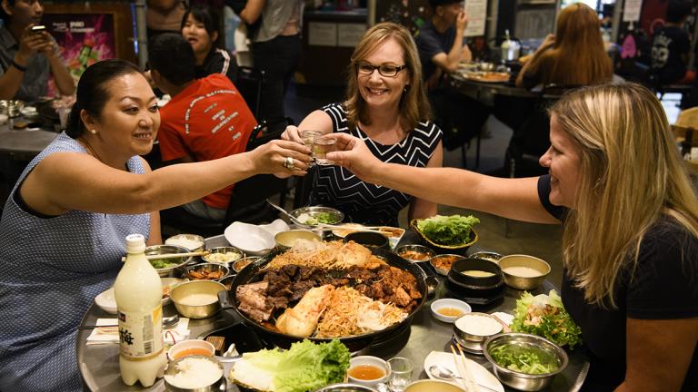 Three women enjoying a Mexican dinner.
