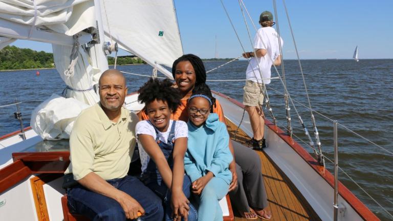 family riding on schooner woodwind