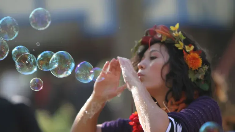 woman blowing bubbles at MD renaissance festival