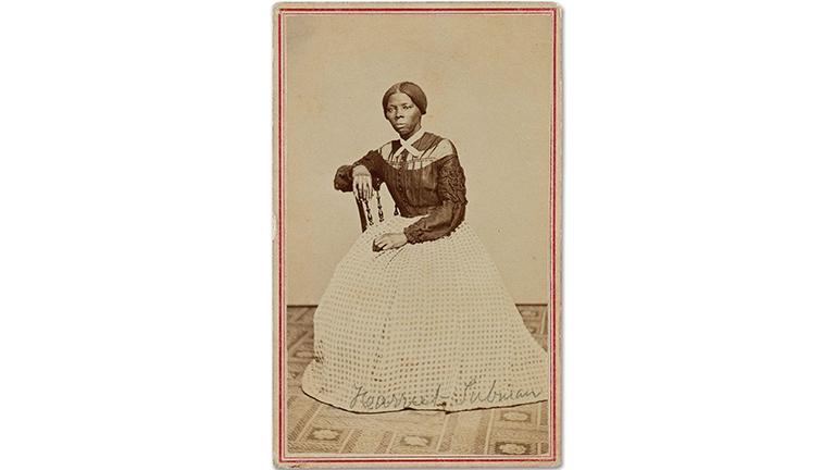 Harriet Tubman sitting in a wooden chair