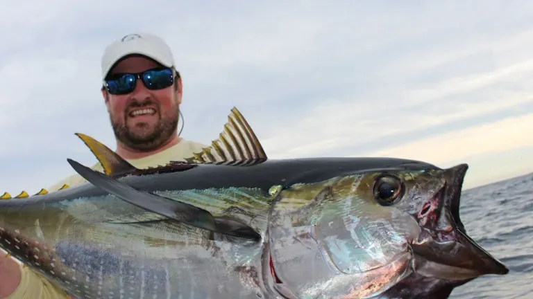 Fisherman holding a large tuna
