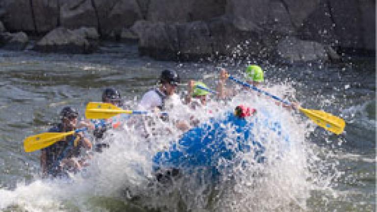 Image of people enjoying whitewater rafting