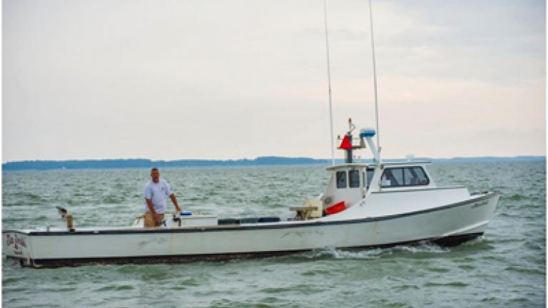 captain and his fishing/crabbing boat