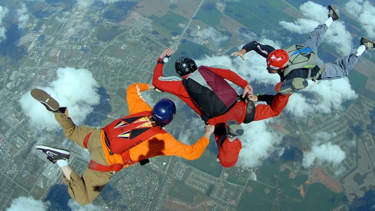 Three people skydiving