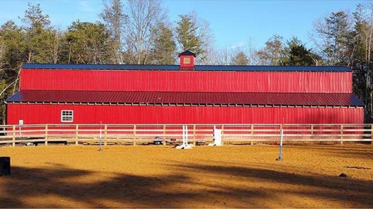 The long red barn at Southern Grace Farm