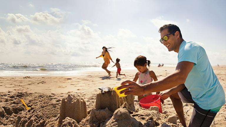 Family building sandcastle 