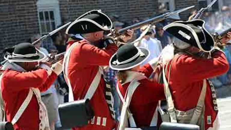 Colonial Re-enactors firing their rifles