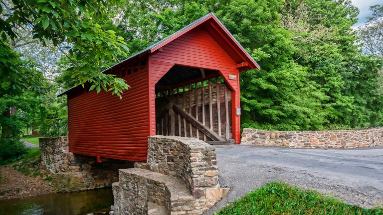 Hop on your bike and see authentic sites like this covered bridge in Frederick Countyy.