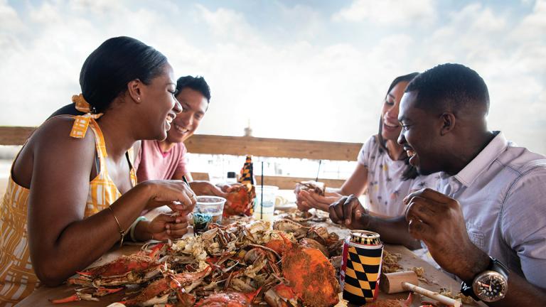 eating crabs by the water