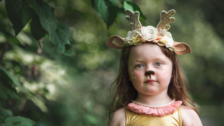 girl wearing woodland creature crown headband