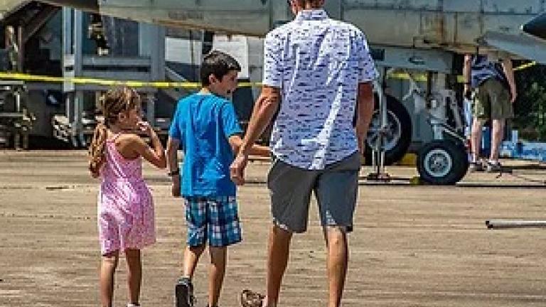 Family looking at airplanes