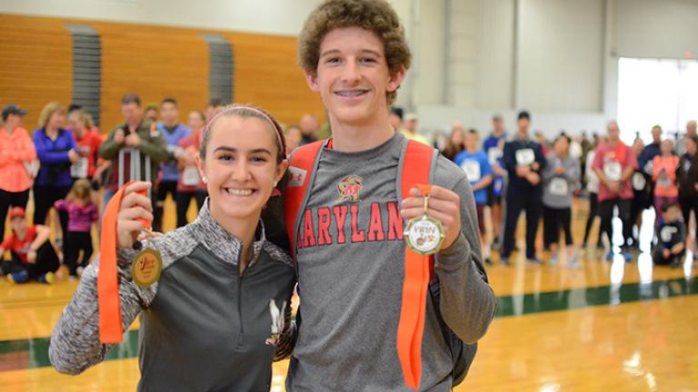 Young people holding medals