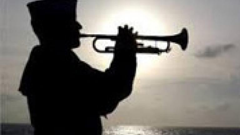 Navy Sailor playing taps