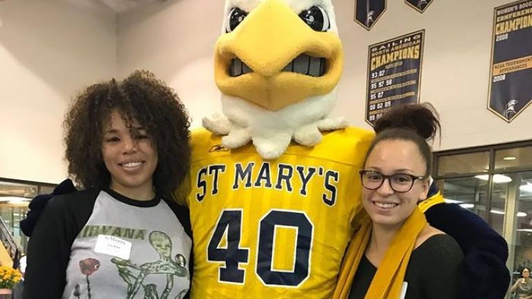 Students posing with mascot
