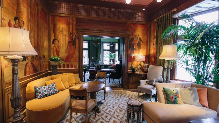 The Ivy Hotel's lush interior offers multiple places to relax in luxury