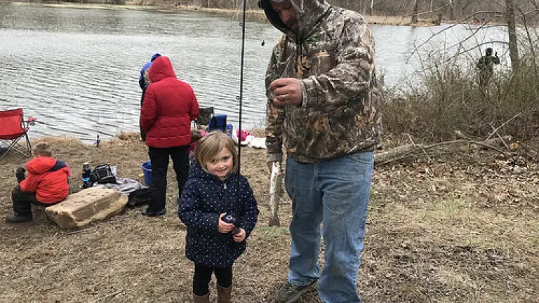 girl catching a fish