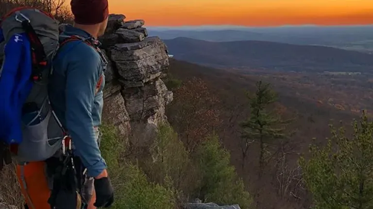 hiker at a hilltop